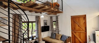 Two bedroom unique loft cabin, in  tranquil setting! Free local breakfast daily!