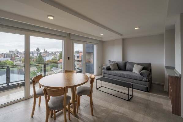 Deluxe Apartment, 1 Bedroom, Balcony, City View | Living area | 40-inch Smart TV with cable channels, Netflix, pay movies