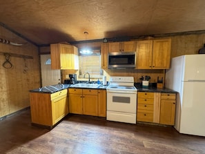 Coffee/tea maker, fridge, microwave, oven