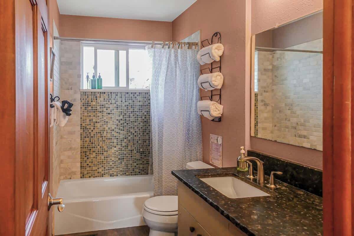 Shower, hair dryer, towels, shampoo