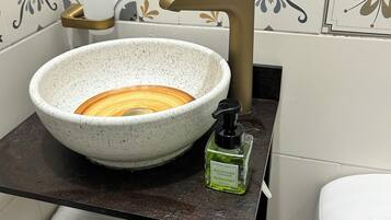 Shower, hair dryer, towels, toilet paper