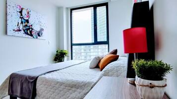 1 bedroom, desk, iron/ironing board, travel crib