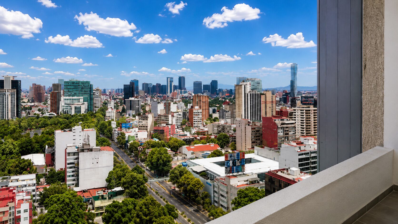 A cityscape with high-rise buildings, a clear sky, and a view of the urban landscape from a high vantage point.