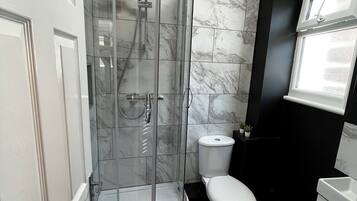 Shower, hair dryer, towels, soap