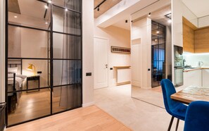 A modern apartment with a kitchen, dining area, and a bedroom. - Tfeli Urban Light (Tbilisi)