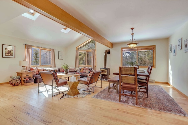 Open Concept Great Room with skylights for natural lighting. Large seating are with sectional couch and accent chairs for your group.
