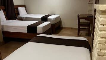 Family Room, Multiple Beds, Garden View | Desk, laptop workspace, blackout curtains, iron/ironing board