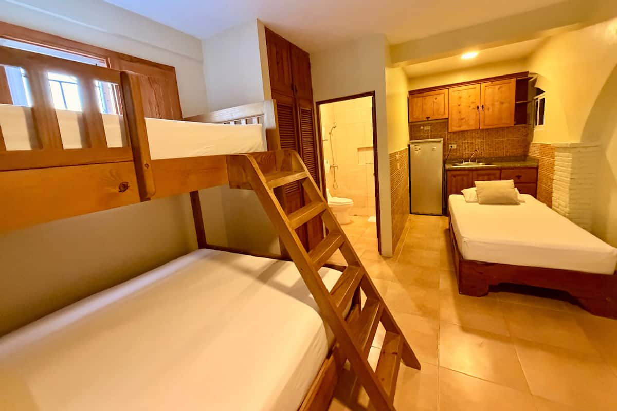 Family Room, Multiple Beds, Garden View | Desk, laptop workspace, blackout drapes, iron/ironing board (on request)