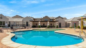 A swimming pool area with lounge chairs and a covered patio. - Our Place; Our Home has an inside slide, gourmet kitchen, view for days, and just feels like home! (Hurricane)