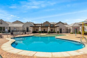 A swimming pool area with lounge chairs and a covered patio. - Our Place; Our Home has an inside slide, gourmet kitchen, view for days, and just feels like home! (Hurricane)