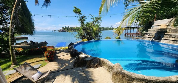 Outdoor pool, open 8:00 AM to 9:00 PM, pool umbrellas