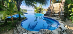 Outdoor pool, open 8:00 AM to 9:00 PM, pool umbrellas - CASA CARIBE HOTEL (Livingston)