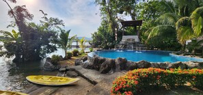 Outdoor pool, open 8:00 AM to 9:00 PM, pool umbrellas