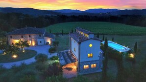 A large estate with multiple buildings, a swimming pool, and a well-maintained lawn. - Exclusive farmhouse with heated swimming pool (Marsciano)