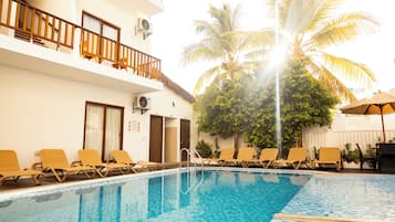 Outdoor pool, open 8:00 AM to 6:00 PM, pool umbrellas, pool loungers