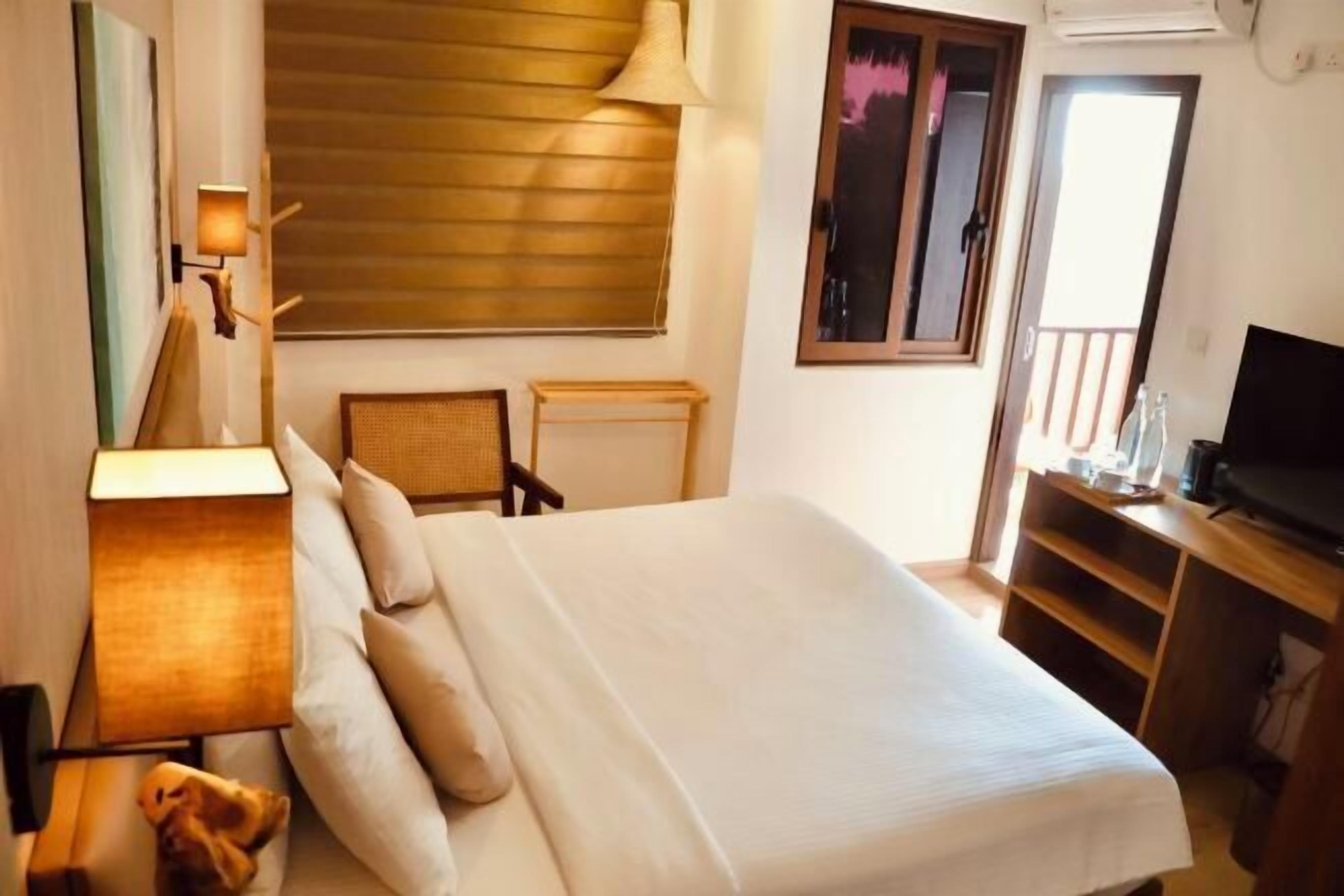 Premium bedding, down duvets, memory-foam beds, in-room safe