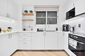 Fridge, microwave, oven, stovetop - Urban Oasis 1BR in Armada with Cityscape Views (Dubai)