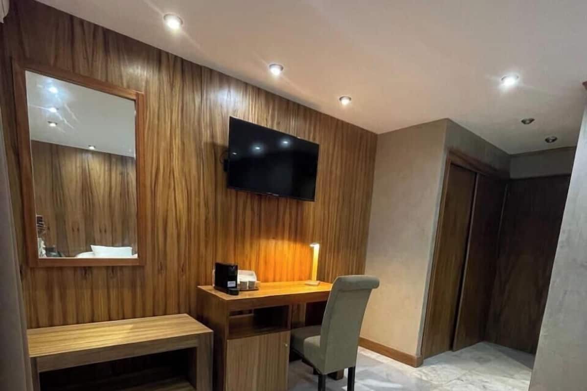 Deluxe Room, Golf View | In-room safe, desk, laptop workspace, soundproofing