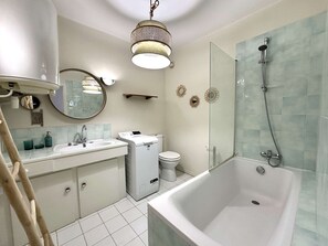 Enjoy a relaxing soak in the bathtub and modern amenities.
