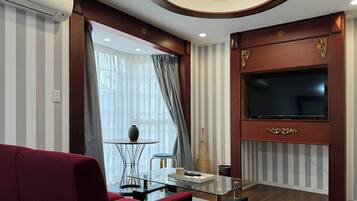 Comfort Twin Room, Courtyard View | Living area | TV