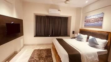 Deluxe Room | Escritorio, espacio para trabajar con laptop, camas extra y wifi gratis