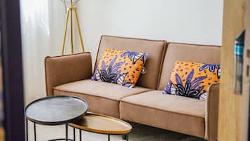 Deluxe Apartment | Living area | Flat-screen TV