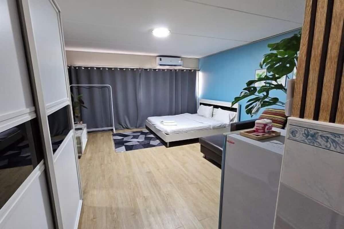 Desk, laptop workspace, bed sheets
