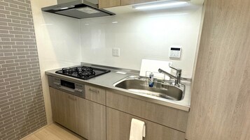 Mini-fridge, microwave, cookware/dishes/utensils