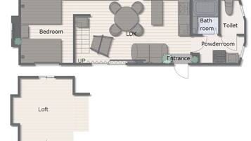 Planta de um quarto de hotel com quarto, sala de estar, banheiro, lavabo e entrada.