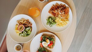 A breakfast tray with toast, fruit, and a cup of coffee. - Alinea Lano Old Town Center (Limassol)