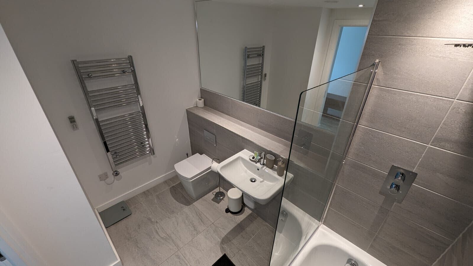 Shower, hair dryer, towels, shampoo