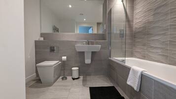 Shower, hair dryer, towels, shampoo