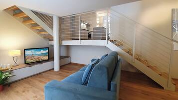 Executive Apartment | Living area | 35-inch Smart TV with digital channels