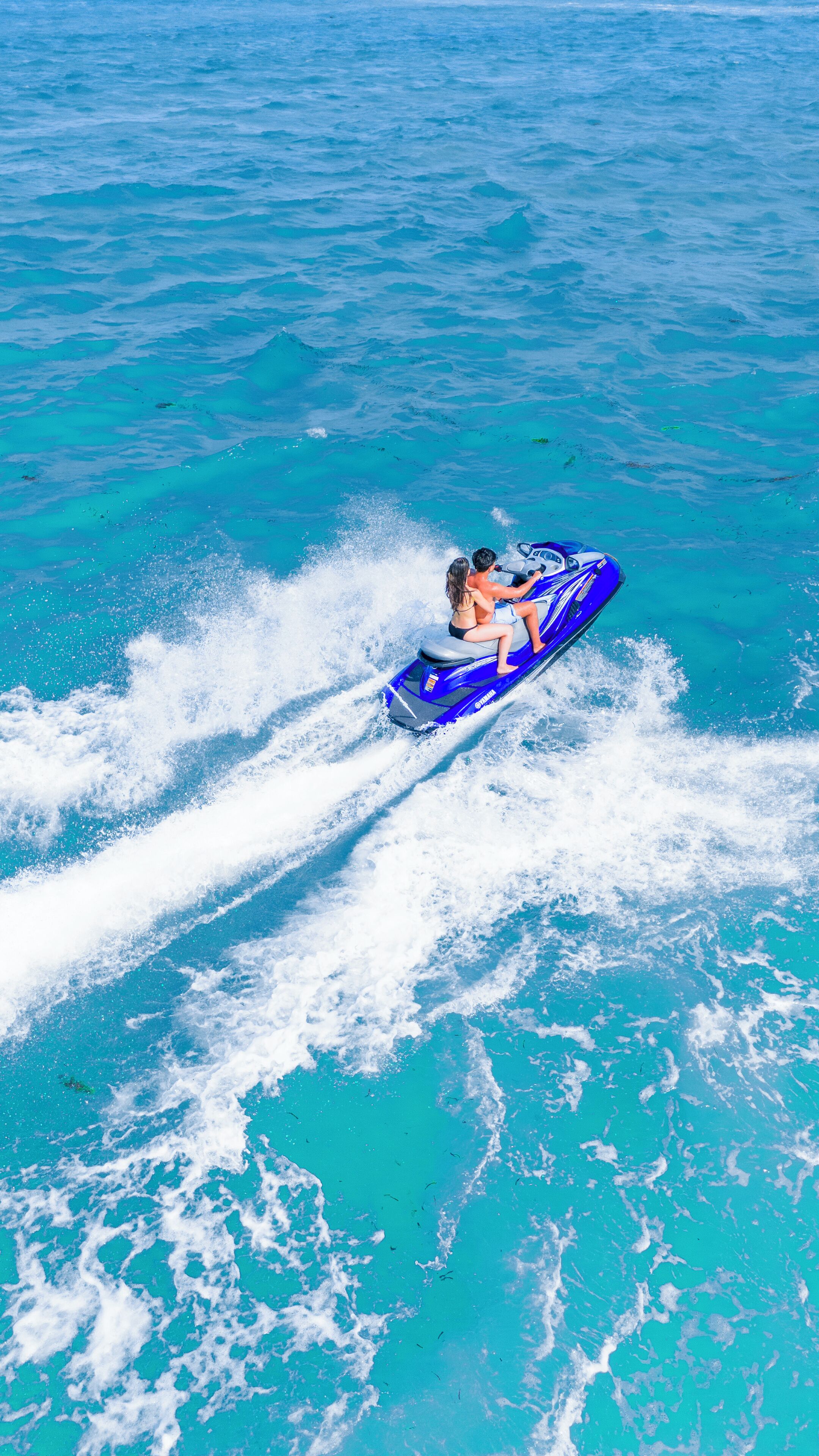 A jet ski on turquoise water.
