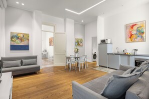 Comfort Apartment, Balcony, City View | Living area | 30-cm Smart TV with cable channels