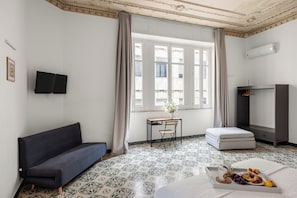 Comfort Quadruple Room, City View | Individually decorated, laptop workspace, iron/ironing board