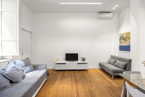 Comfort Apartment, Balcony, City View | Living area | 30-cm Smart TV with cable channels