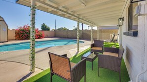 A covered patio with a pool, outdoor furniture, and a view of the pool. - 11 Mi to Dtwn Phoenix: Main House w/ Outdoor Oasis (Phoenix)