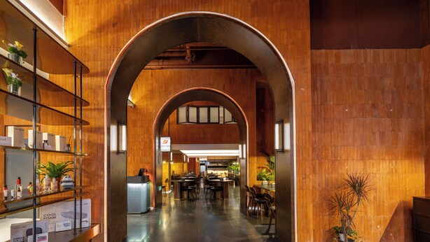 A spacious hotel lobby with a wooden interior, a reception desk, and seating areas. - XIAMEN ZHONGSHAN ROAD  QULISTAR HOTEL (Xiamen)