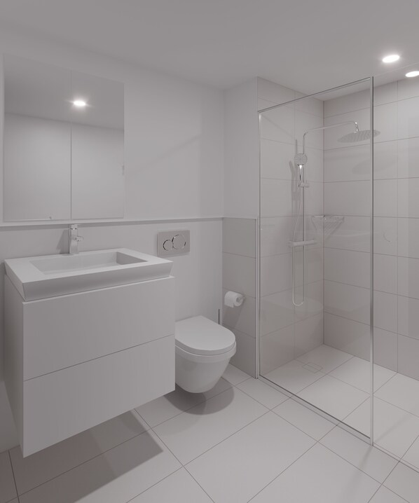 Un baño moderno con ducha de vidrio, lavamanos blanco y retrete.