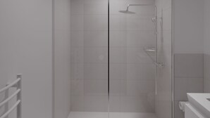 Ein modernes Badezimmer mit Duschkabine aus Glas, einer weißen Toilette und einem weißen Waschbecken.