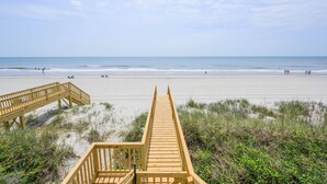 A wooden boardwalk leading to a beach with a clear sky. - Oceanfront 7 BR Beach House with a Private Pool! Sandy Days (Surfside Beach)