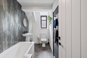 Shower, hair dryer, towels, toilet paper