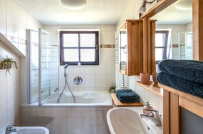 Jetted tub, hair dryer, towels, soap