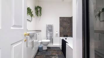 Shower, hair dryer, towels, toilet paper