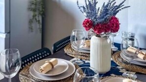 A dining table set with plates, glasses, and a centerpiece. - Brand New Scotland home 3rooms near Glasgow
 (Hardgate)