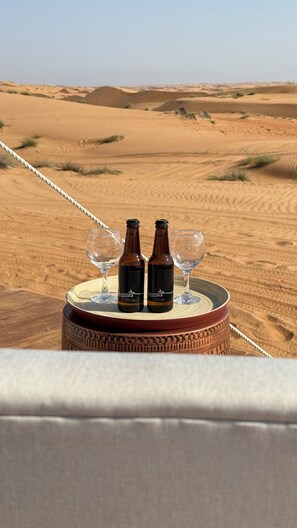 Relax in a serene desert setting with a table for two.
