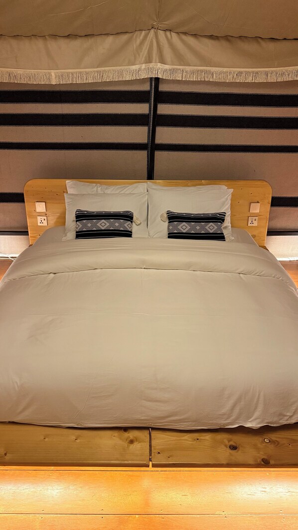 Restful retreat with a comfortable bed and stylish headboard.
