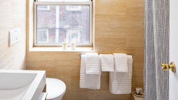 Shower, hair dryer, towels