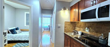 Fridge, microwave, stovetop, coffee/tea maker